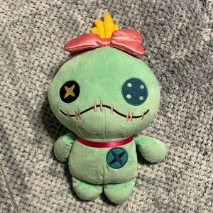 Green Plush Toy with Pink Bow